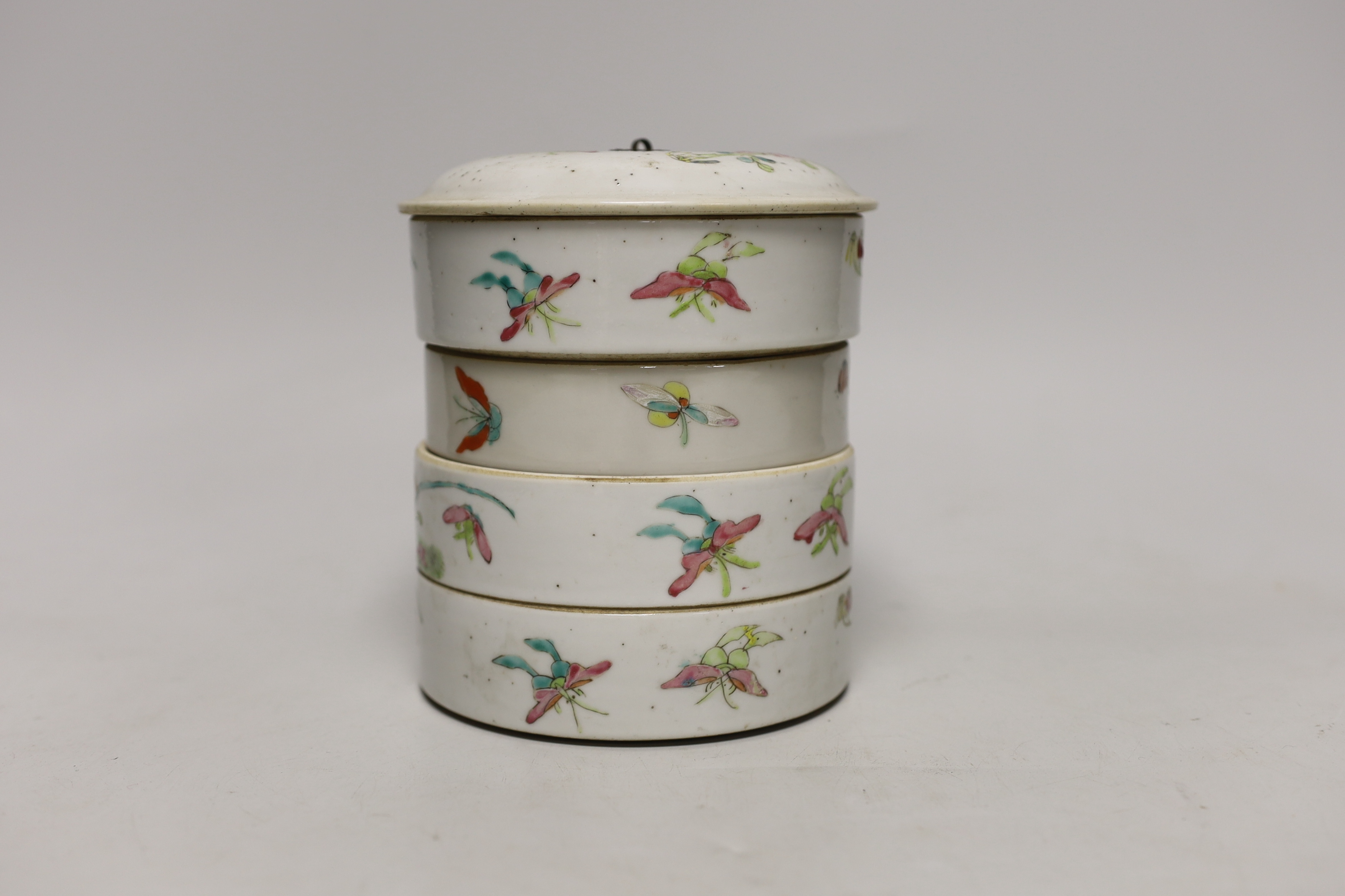 An early 20th century Chinese enamelled porcelain four section stacking food container and cover 14cm high